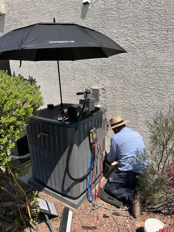 HVAC technician performing outdoor AC maintenance in Yulee